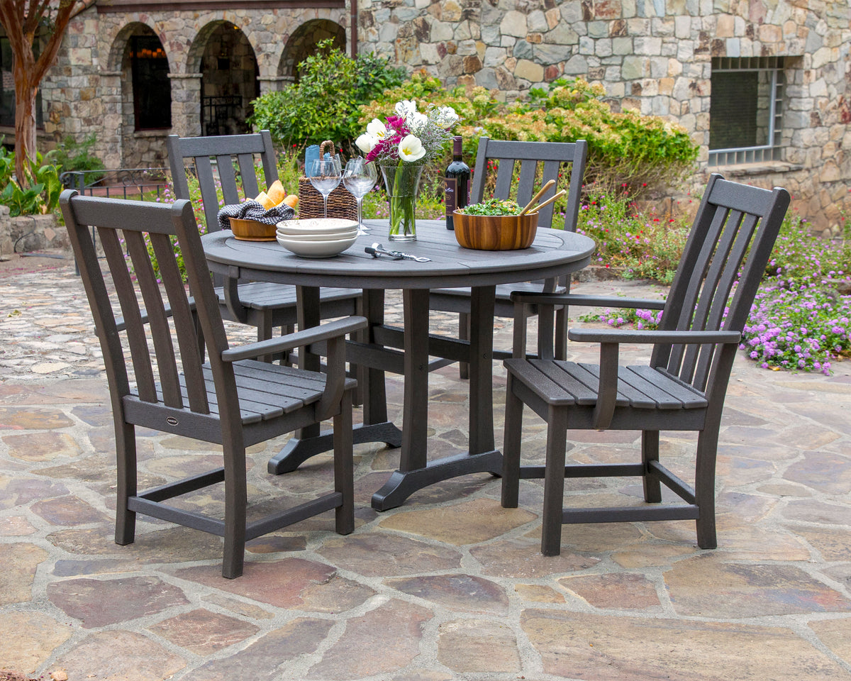 Lifestyle photo of the POLYWOOD Vineyard 5-Piece Round Dining Set with Trestle Legs