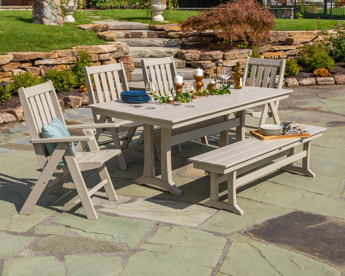 Lifestyle photo of the POLYWOOD Vineyard 6-Piece Folding Chair Farmhouse Dining Set with Trestle Legs and Bench