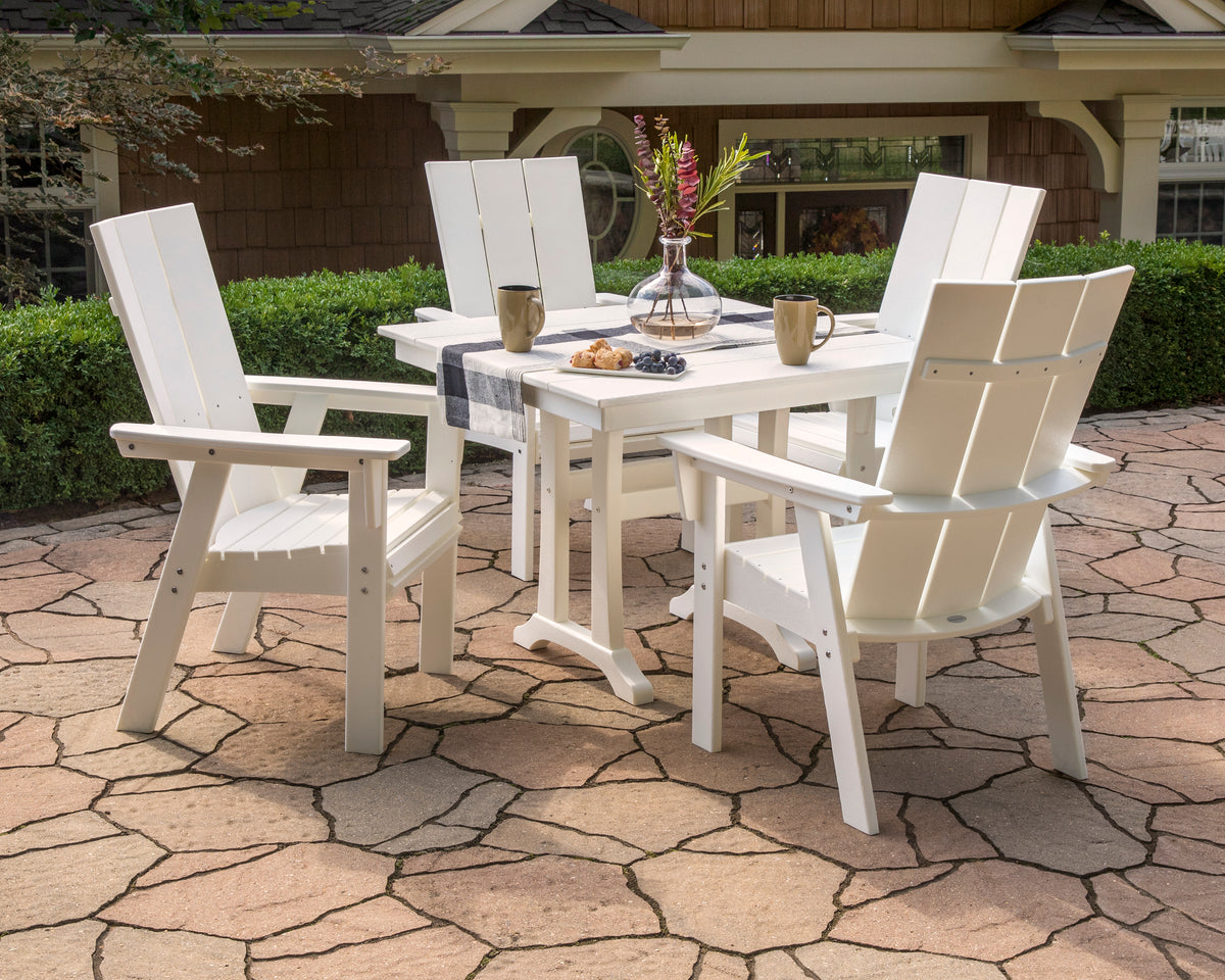 Lifestyle photo of the POLYWOOD Modern Curveback Adirondack 5-Piece Farmhouse Trestle Dining Set
