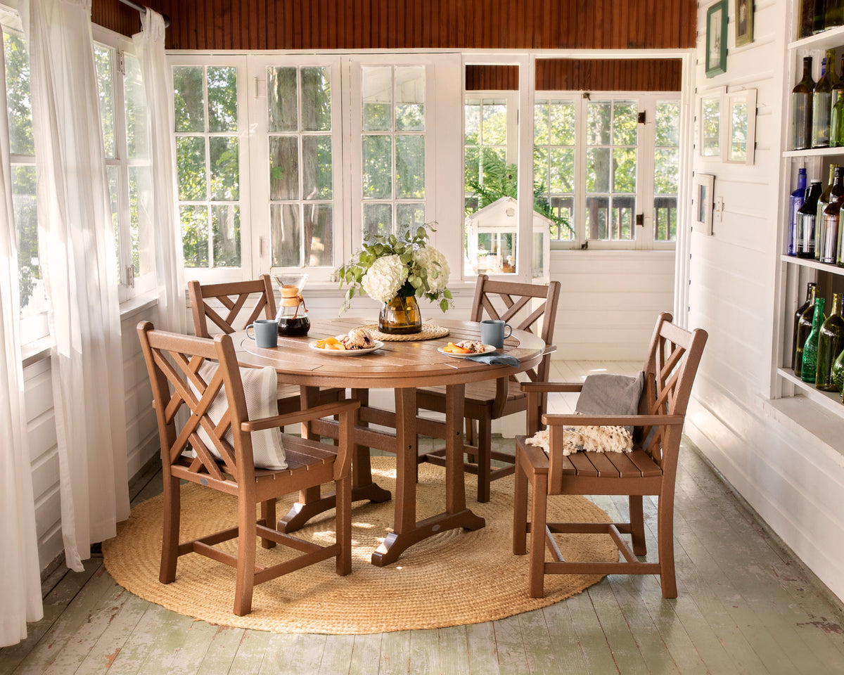 Lifestyle photo of the POLYWOOD Chippendale 5-Piece Nautical Trestle Dining Arm Chair Set
