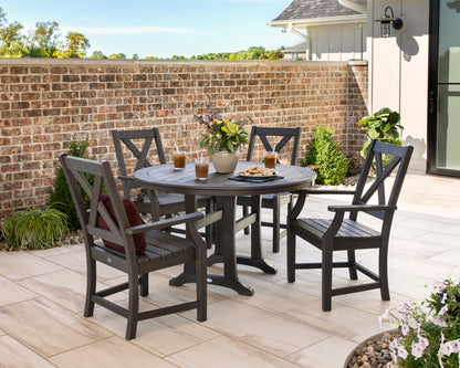 Lifestyle photo of the POLYWOOD Braxton 5-Piece Nautical Trestle Arm Chair Dining Set