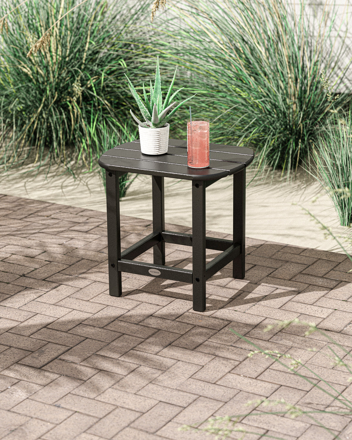 POLYWOOD South Beach 18" Side Table in Black in an outdoor setting