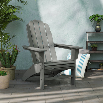 Lifestyle photo of the POLYWOOD Vineyard Curveback Adirondack Chair in Slate Grey