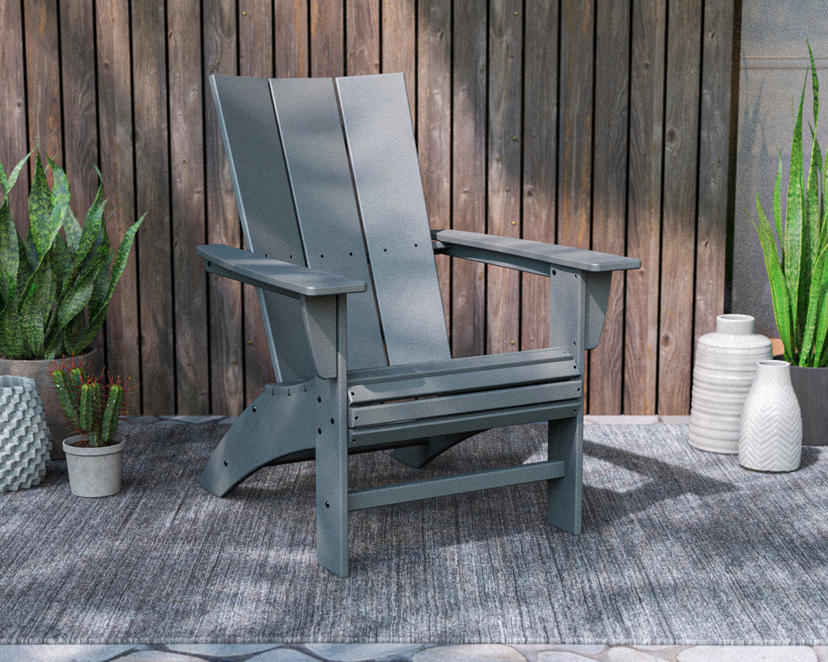 POLYWOOD Modern Curveback Adirondack Chair in Slate Grey styled outdoors