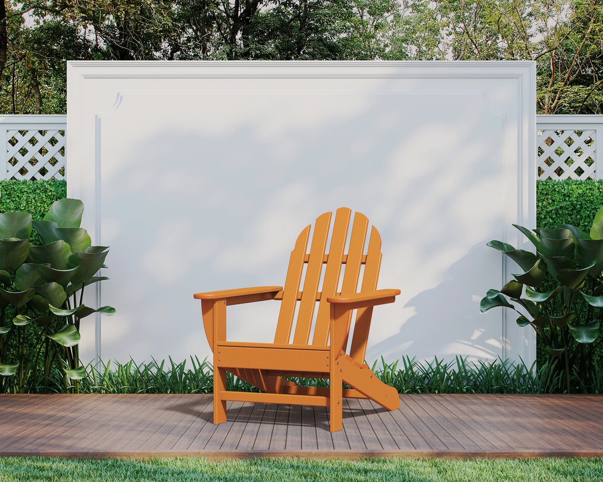 Lifestyle photo of the POLYWOOD Classic Adirondack Chair in Tangerine