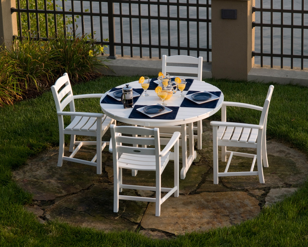 Lifestyle photo of the POLYWOOD La Casa Café Dining Arm Chair in White