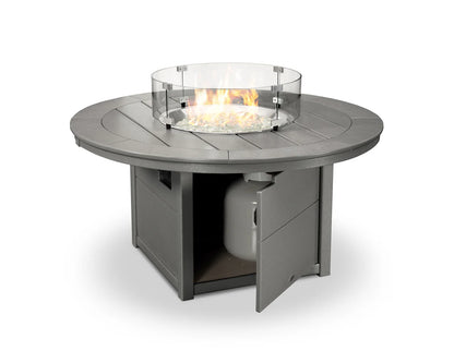 Round outdoor fire table with glass cover on a white background
