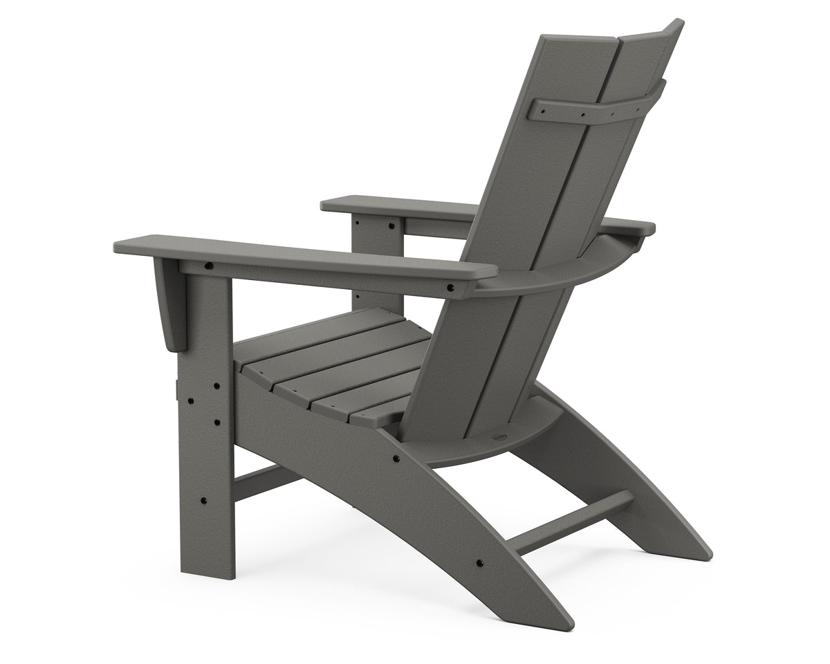 Angled view of the POLYWOOD Modern Curveback Adirondack Chair in Slate Grey