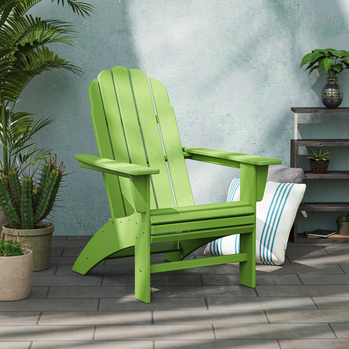 Lifestyle photo of the POLYWOOD Vineyard Curveback Adirondack Chair in Lime