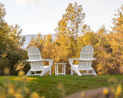 Lifestyle photo of the POLYWOOD Vineyard 3-Piece Curveback Adirondack Set in White
