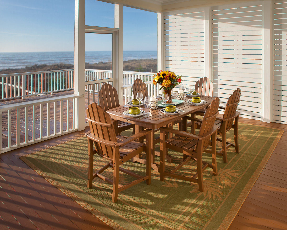 Lifestyle photo of the POLYWOOD Classic Adirondack Dining Chair in Teak