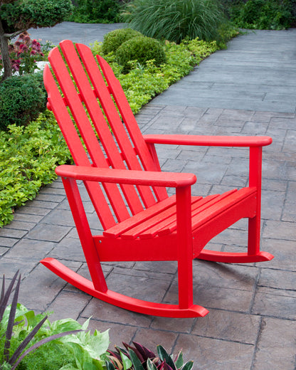 POLYWOOD Classic Adirondack Rocking Chair in Sunset Red in an outdoor setting