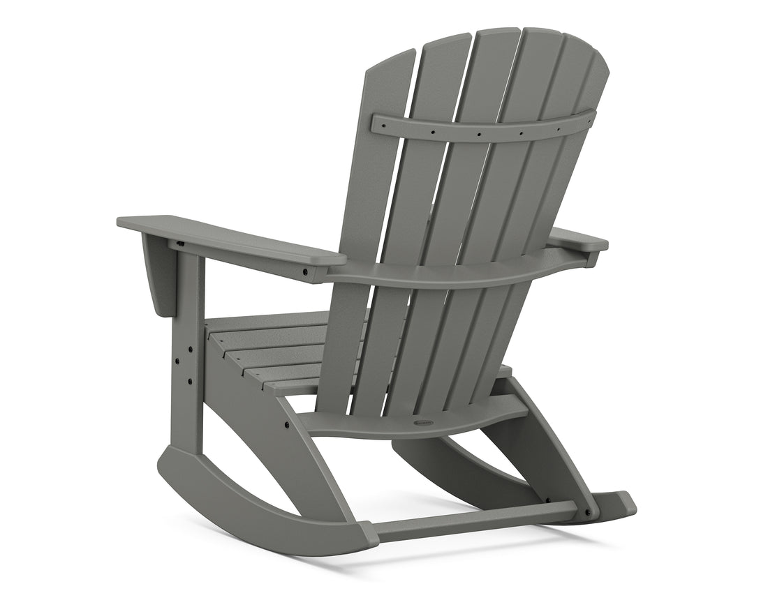 Angled view of the POLYWOOD Nautical Curveback Adirondack Rocking Chair in Slate Grey