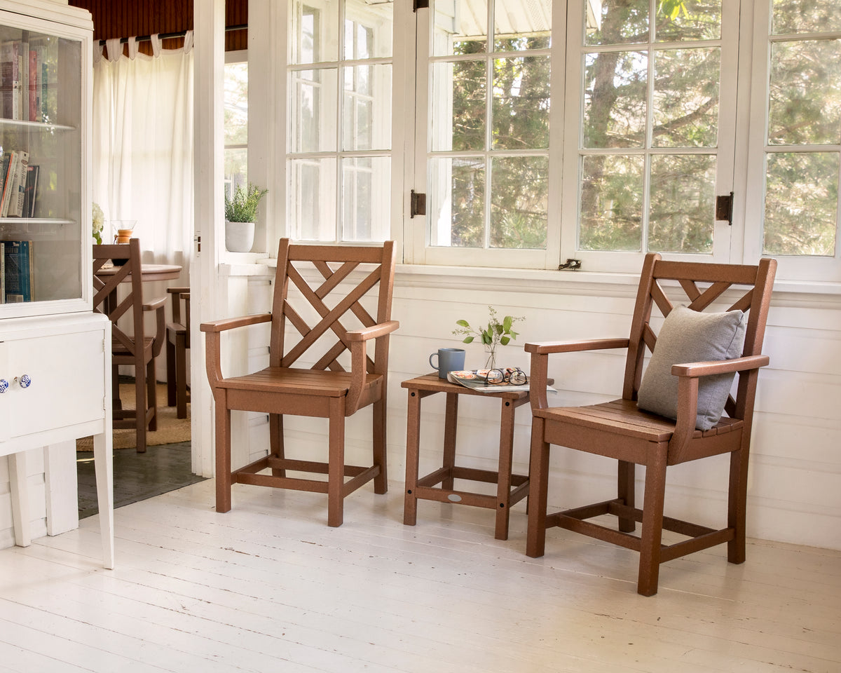 Lifestyle photo of the POLYWOOD Chippendale Dining Arm Chair in Teak