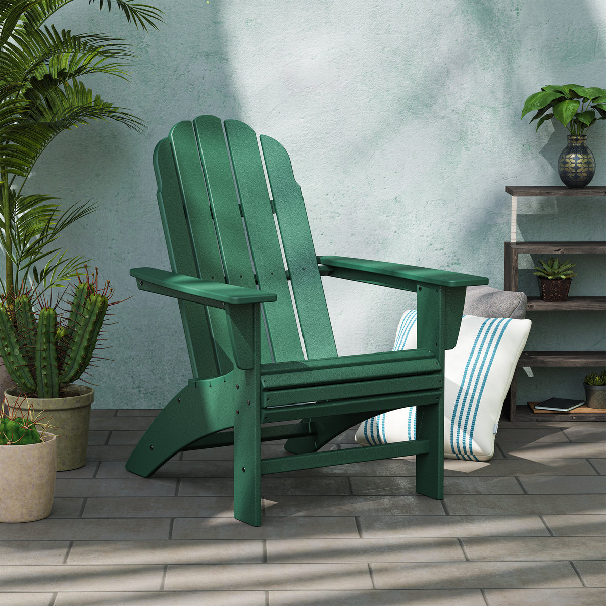 POLYWOOD Vineyard Curveback Adirondack Chair in Green in an outdoor setting