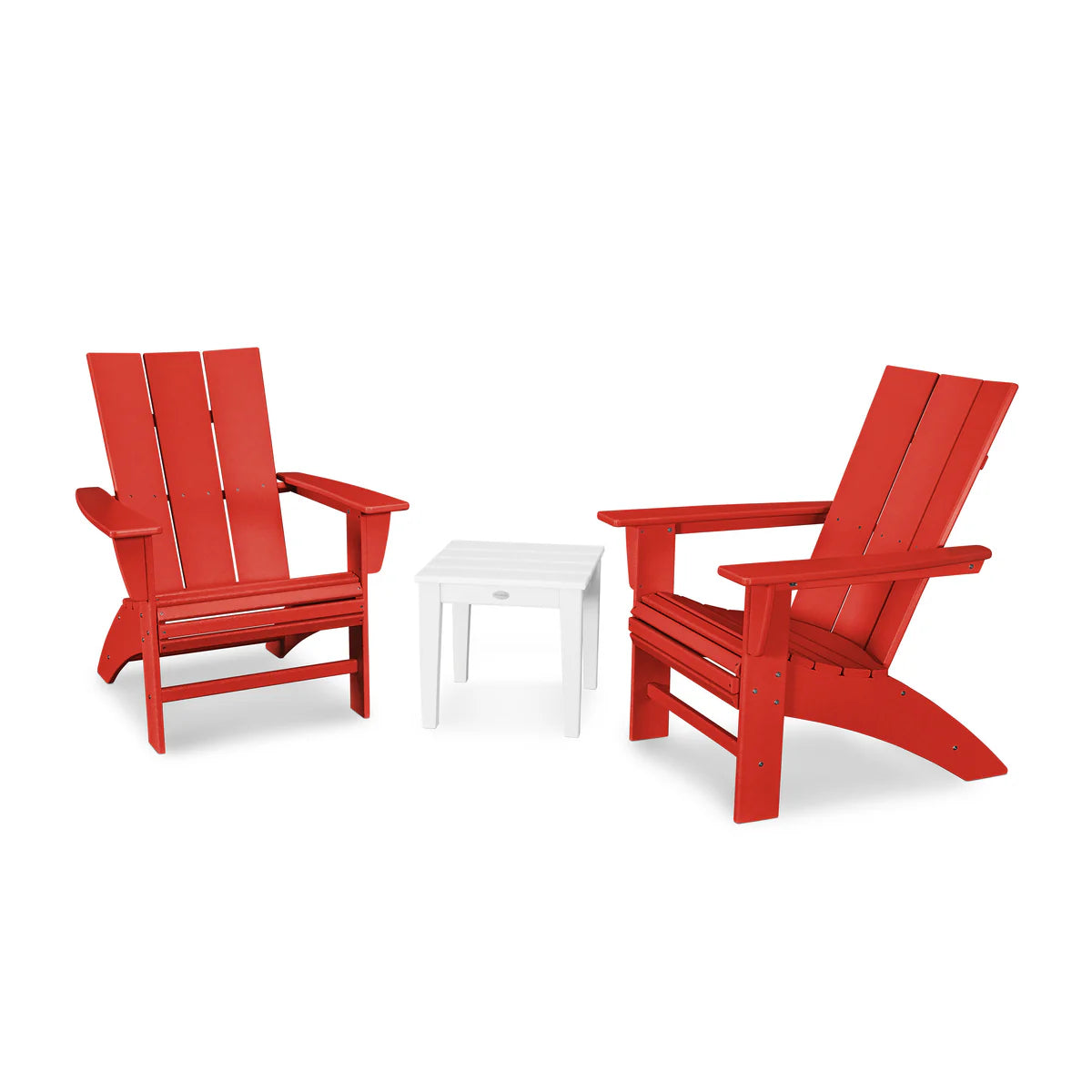 Two red Adirondack chairs with a white table on a white background
