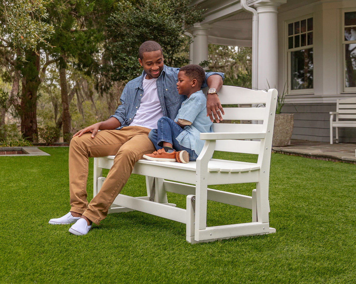Lifestyle photo of the POLYWOOD Savannah 48" Glider in White