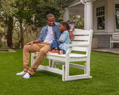 Lifestyle photo of the POLYWOOD Savannah 48" Glider in White