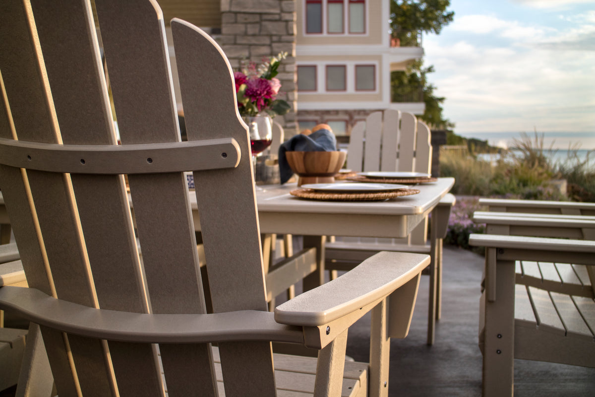 Feature close-up of the POLYWOOD Vineyard Curveback Adirondack Dining Chair in Sand