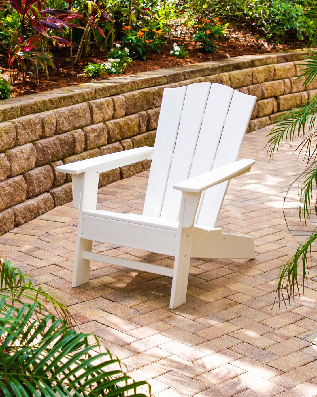 POLYWOOD The Crest Chair in White in an outdoor setting