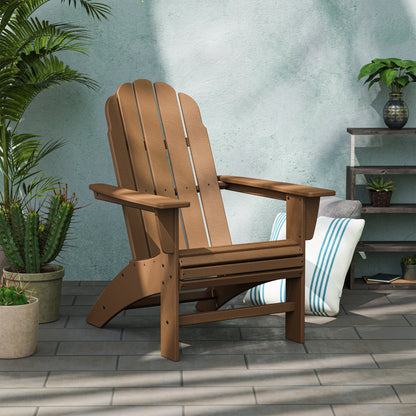 Lifestyle photo of the POLYWOOD Vineyard Curveback Adirondack Chair in Teak