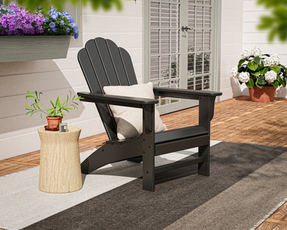 POLYWOOD Cottage Adirondack Chair in Black in an outdoor setting
