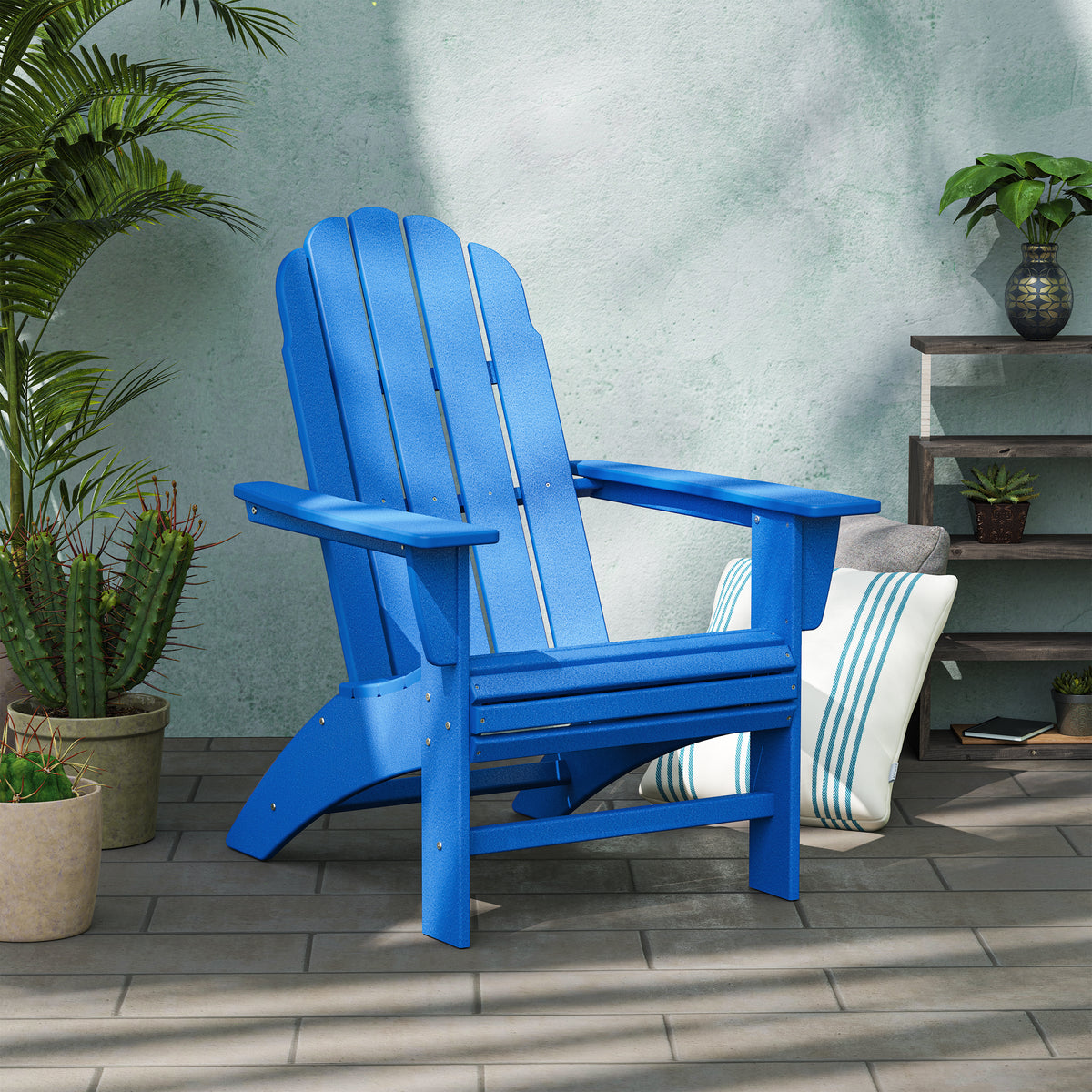 POLYWOOD Vineyard Curveback Adirondack Chair in Pacific Blue in an outdoor setting