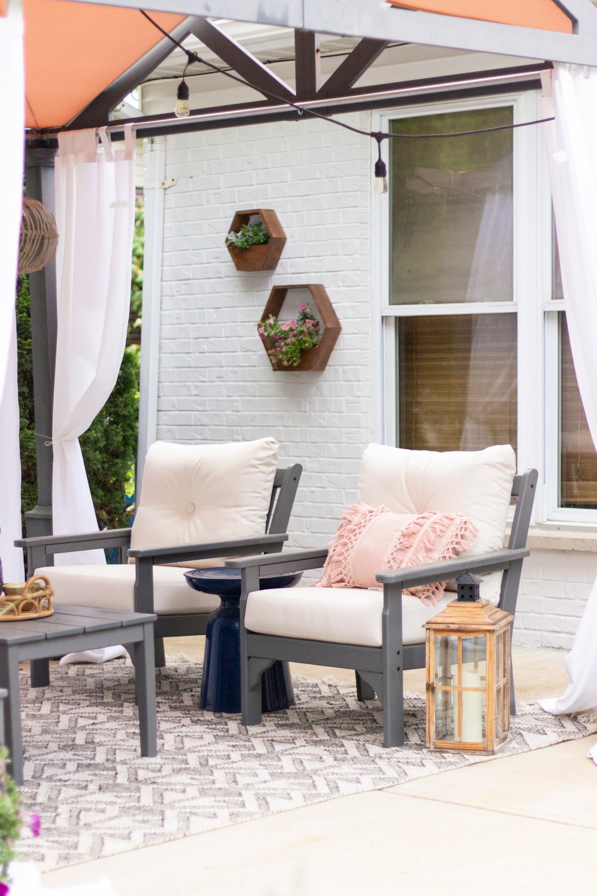 POLYWOOD Vineyard 4-Piece Deep Seating Set with Two Chairs and Loveseat in an outdoor setting