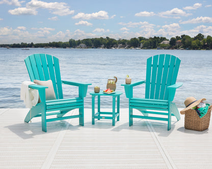 Lifestyle photo of the POLYWOOD Nautical Curveback Adirondack Chair in Aruba