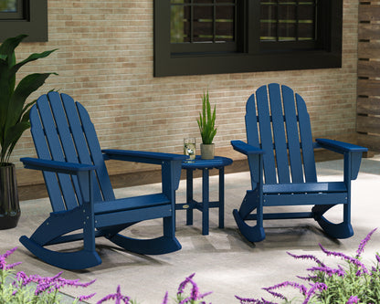 Lifestyle photo of the POLYWOOD Vineyard 3-Piece Adirondack Rocking Chair Set with 18" Round Table in Navy