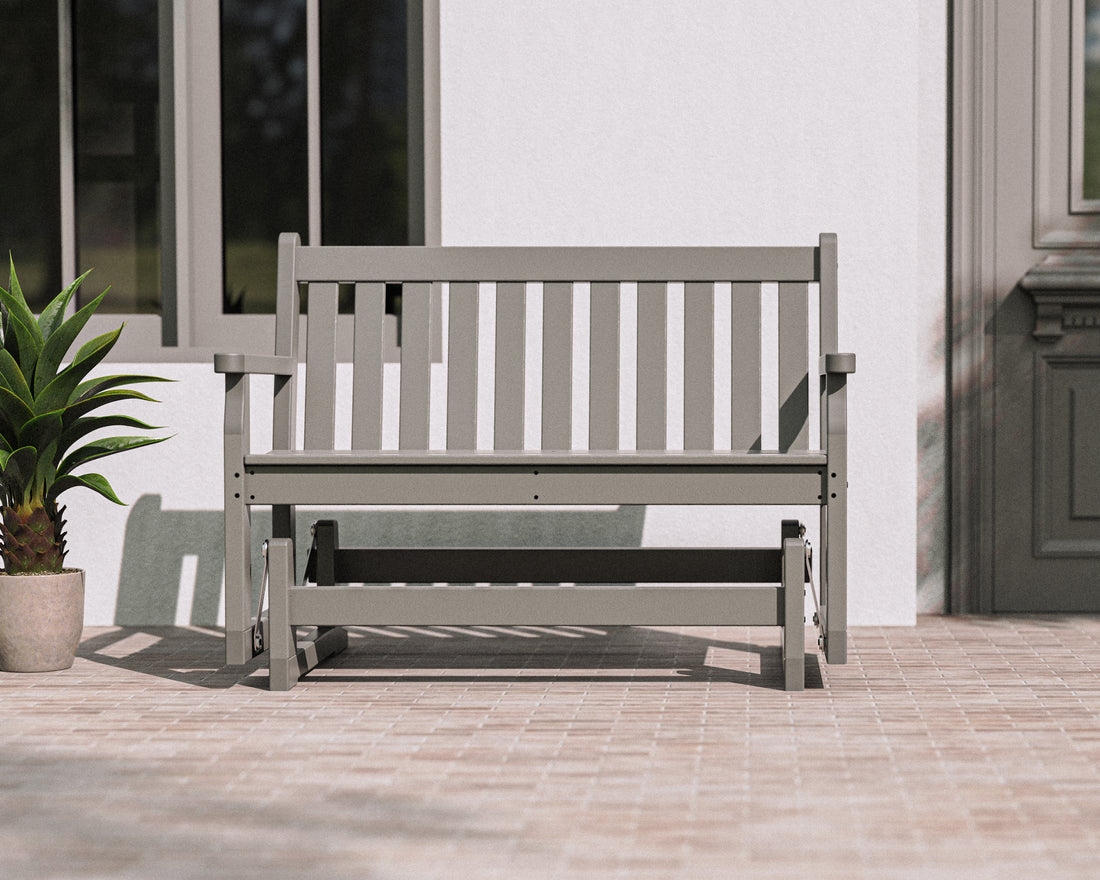 POLYWOOD Traditional Garden 48" Glider in Slate Grey in an outdoor setting