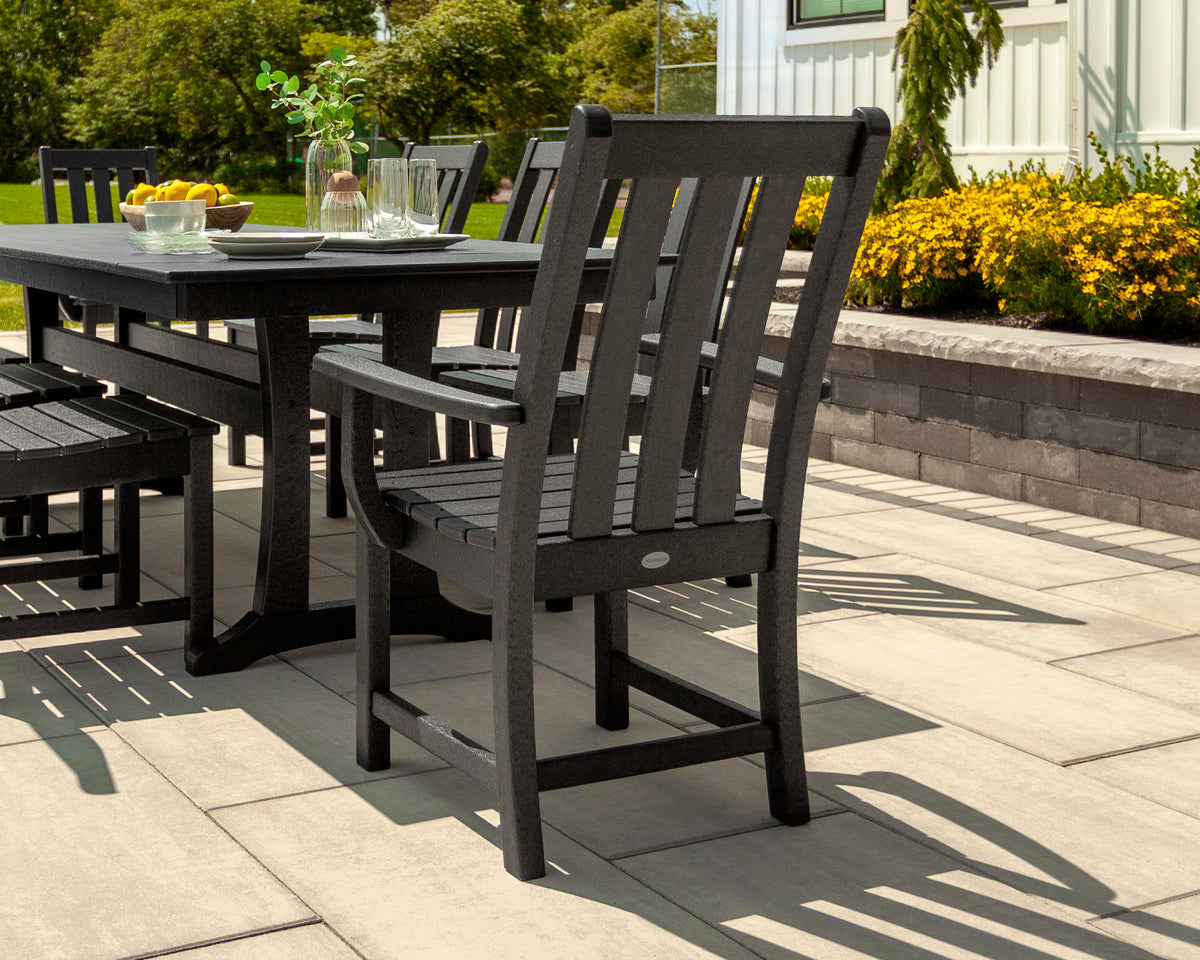 POLYWOOD Vineyard Dining Arm Chair in Black in an outdoor setting