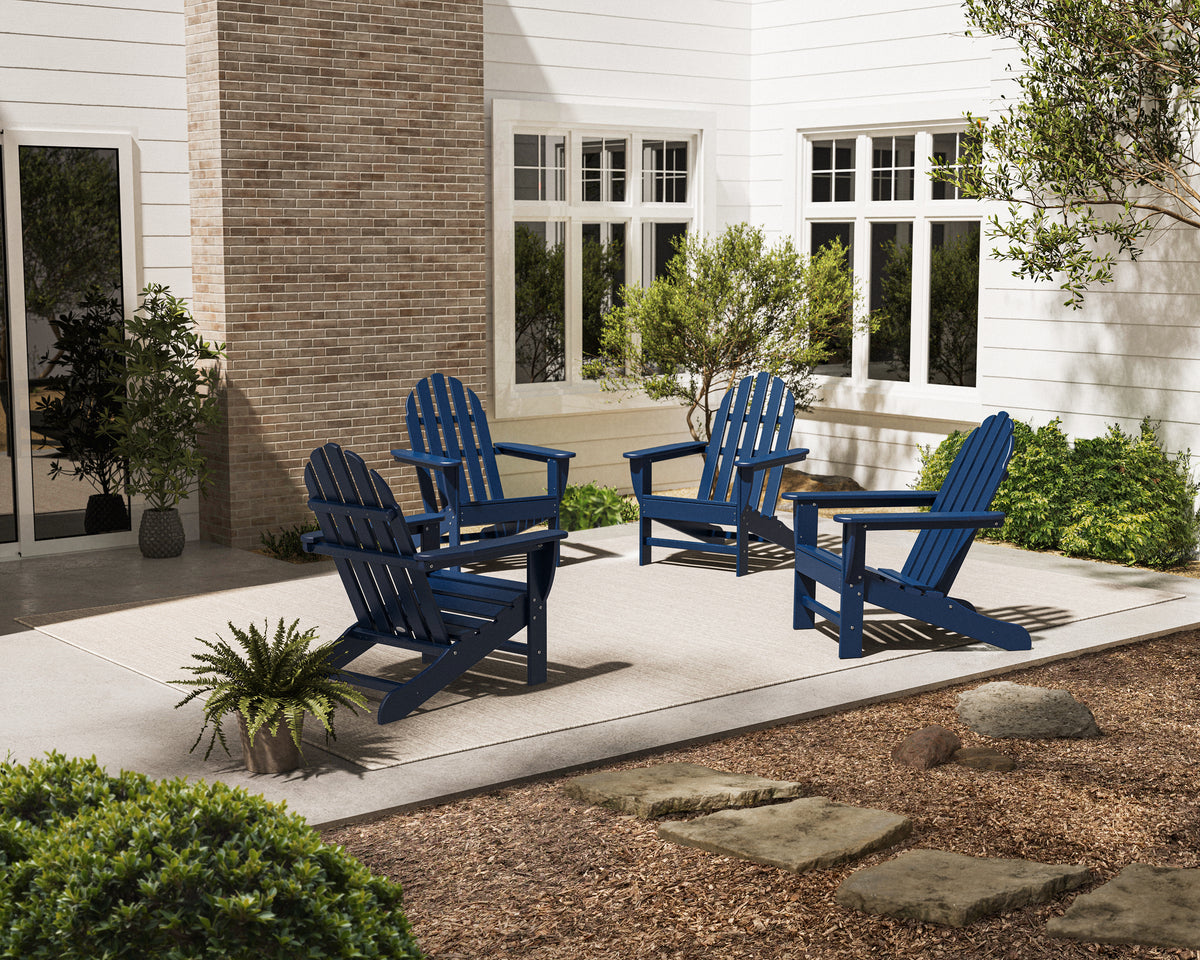Lifestyle photo of the POLYWOOD 4-Piece Classic Adirondack Conversation Set in Navy