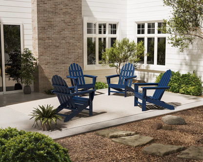 Lifestyle photo of the POLYWOOD 4-Piece Classic Adirondack Conversation Set in Navy