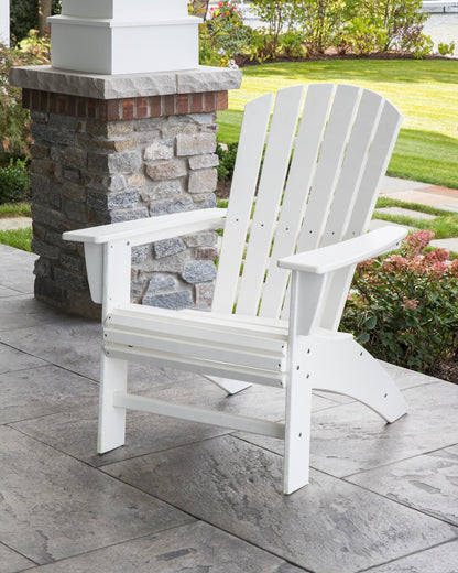 POLYWOOD Nautical Curveback Adirondack Chair in White in an outdoor setting