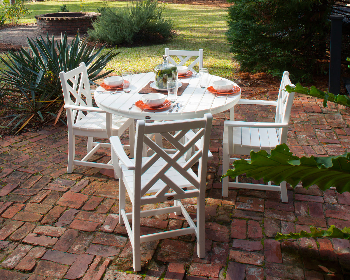 POLYWOOD Chippendale 5-Piece Round Farmhouse Dining Set in White in an outdoor setting