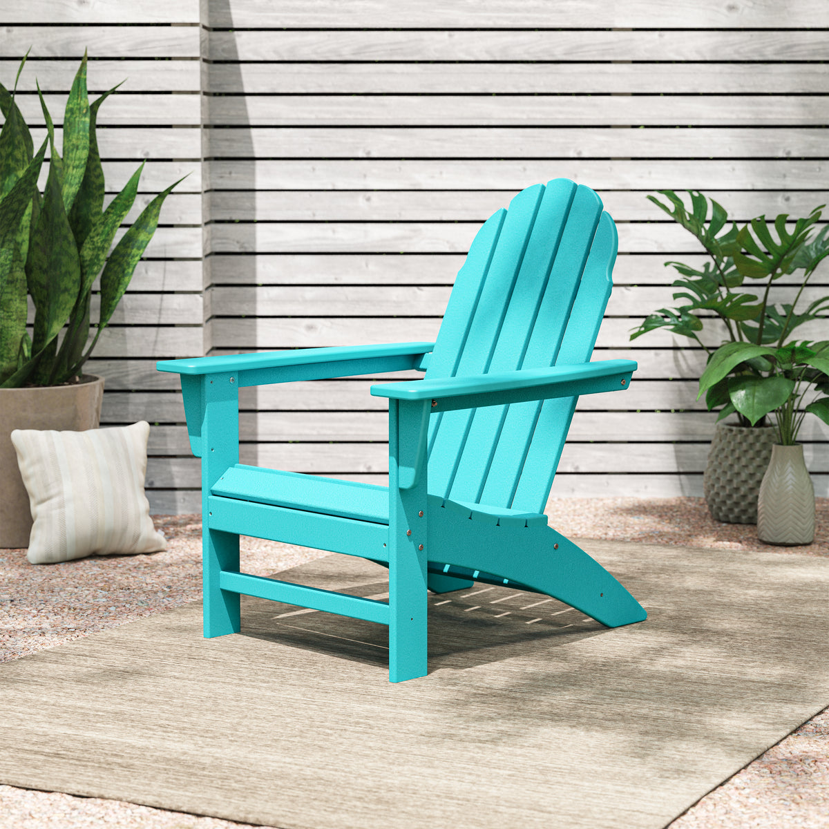 Lifestyle photo of the POLYWOOD Vineyard Adirondack Chair in Aruba