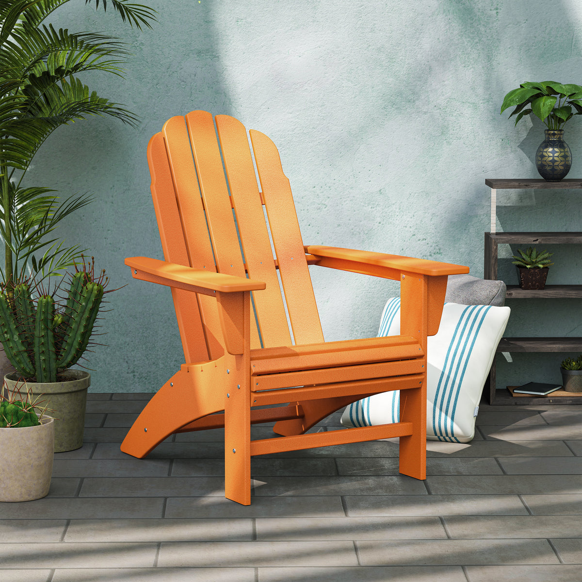 POLYWOOD Vineyard Curveback Adirondack Chair in Tangerine styled outdoors
