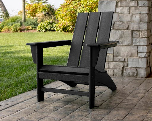 POLYWOOD Modern Adirondack Chair in Black in an outdoor setting