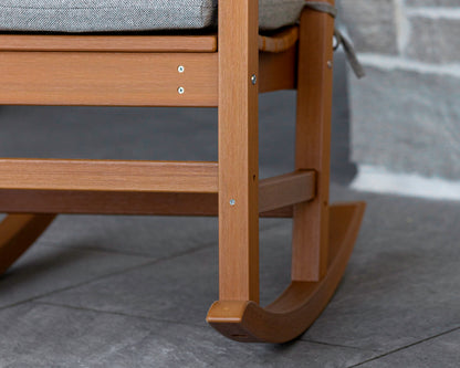 POLYWOOD Nautical Porch Rocking Chair in Natural on a front porch