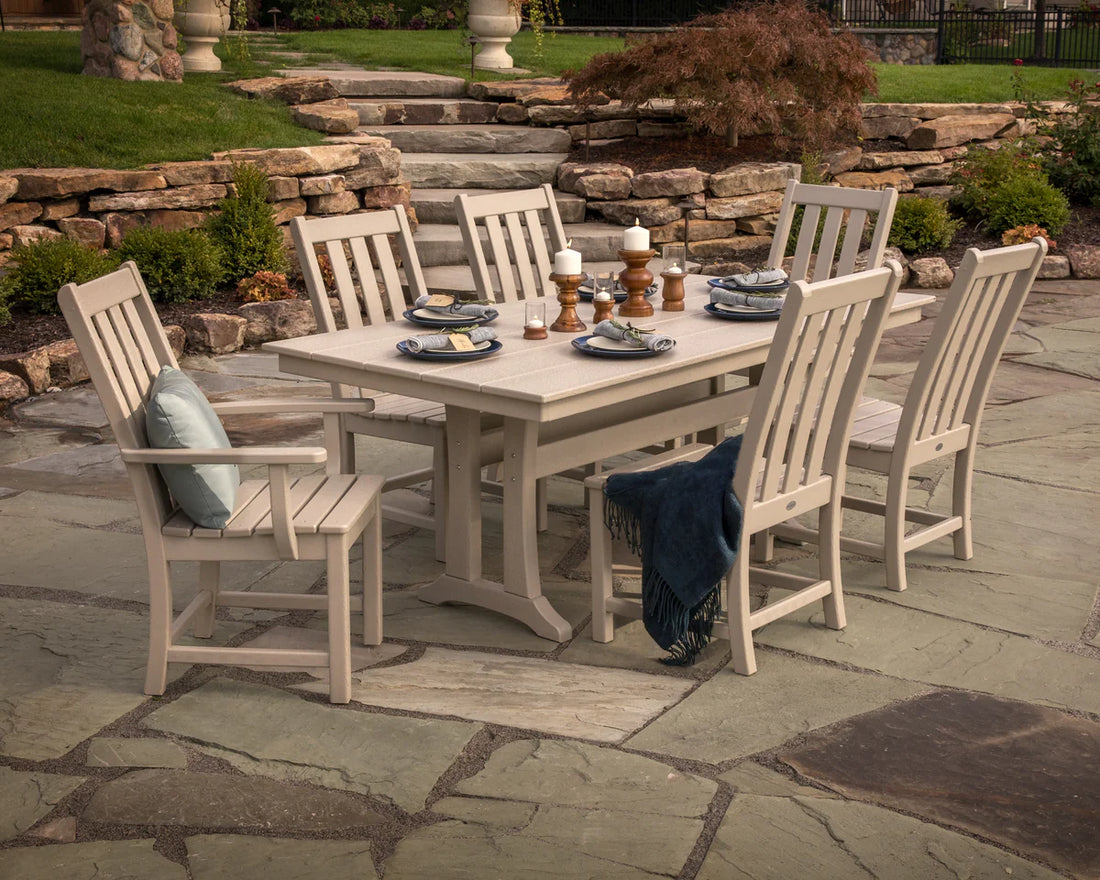 Outdoor dining set with table and chairs on a stone patio