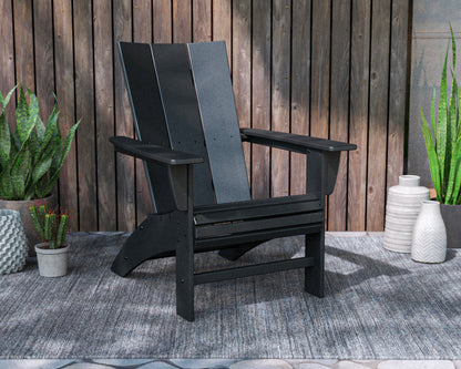 Lifestyle photo of the POLYWOOD Modern Curveback Adirondack Chair in Black