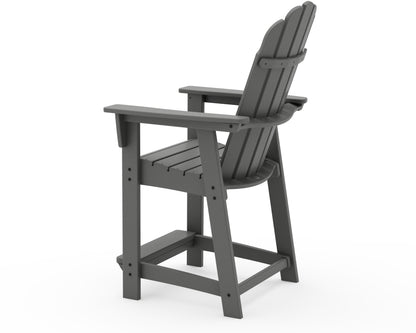 Angled view of the POLYWOOD Vineyard Curveback Adirondack Counter Chair in Slate Grey